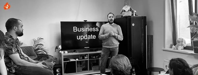 A team member presenting a business update to the team